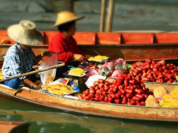 and-women-sell-piles-of-fresh-fruits-and-vegetables-in-floating-markets-on-the-river-there-are-several-floating-markets-around-bangkok