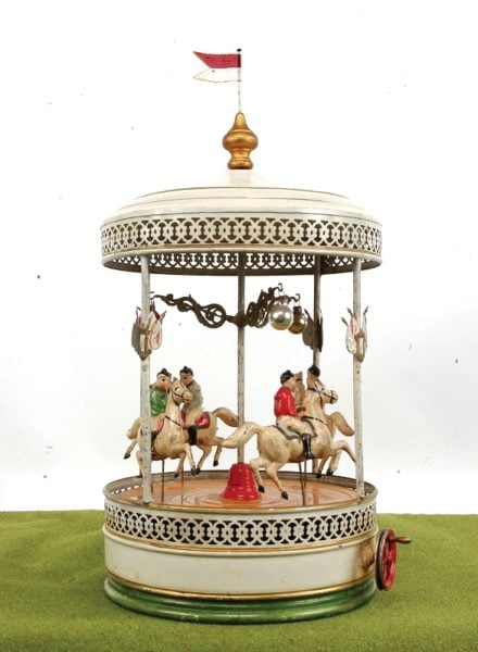 76. Doll tinplate carousel